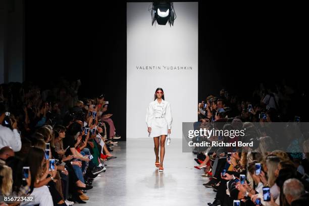 Model walks the runway during the Valentin Yudashkin show as part of Paris Fashion Week Womenswear Spring/Summer 2018 on October 2, 2017 in Paris,...