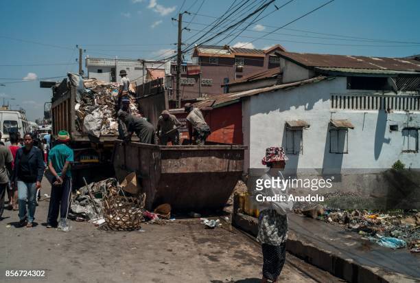 Workers remove garbage in Antananrivo, Madagascar as plague spreads rapidly in cities across the country on October 2, 2017. Twenty people have died...