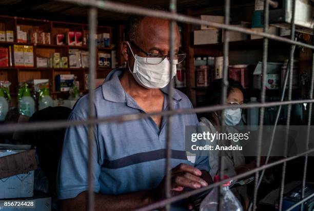 Man wearing a face mask works in Antananrivo, Madagascar as plague spreads rapidly in cities across the country on October 2, 2017. Twenty people...