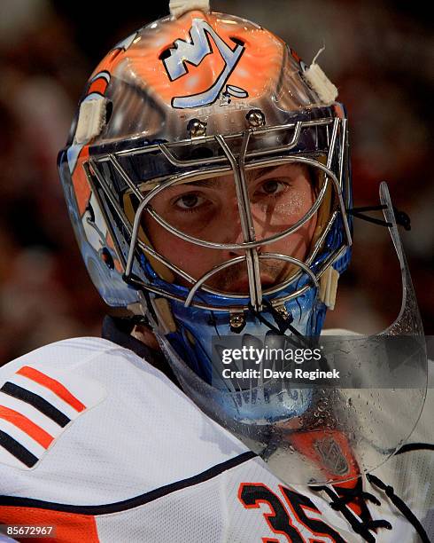 Joey MacDonald of the New York Islanders pauses during a NHL game against the Detroit Red Wings on March 27, 2009 at Joe Louis Arena in Detroit,...