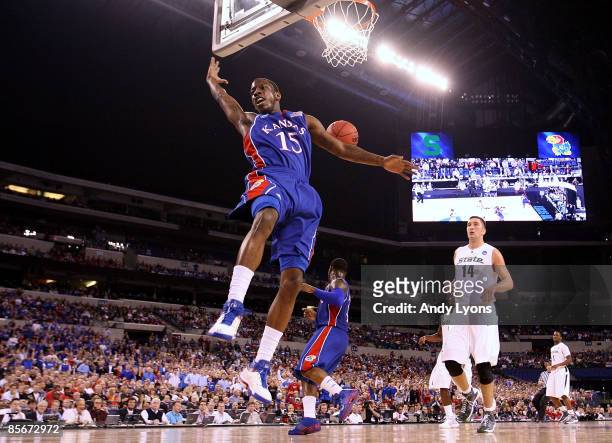 Tyshawn Taylor of the Kansas Jayhawks reacts after he dunked the ball against the Michigan State Spartans during the third round of the NCAA Division...