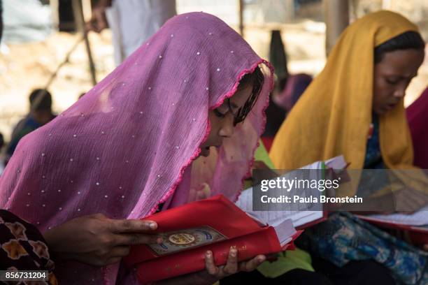 Rohingya children attend religious school which just started up at a makeshift madrassa run by a local muslim group on October 2, 2017 in Balukhali...