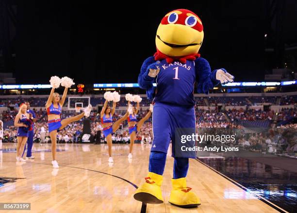 Jayhawk, the mascot of the Kansas Jayhawks performs along with the Kansas cheerleaders the Michigan State Spartans during the third round of the NCAA...