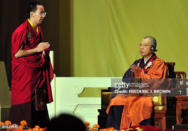 China's controversial choice as the second highest Tibetan spiritual figure, the 19-year-old Panchen Lama , gestures before delivering his speech...