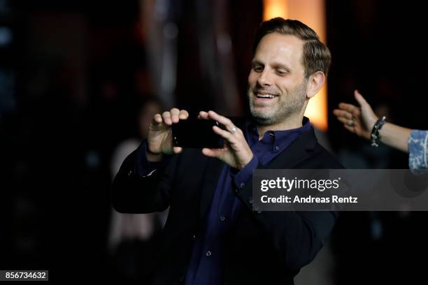 Matt Ruskin takes a picture as he attends the 'Crown Heights' photocall during the 13th Zurich Film Festival on October 2, 2017 in Zurich,...