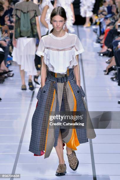 Model walks the runway at the Sacai Spring Summer 2018 fashion show during Paris Fashion Week on October 2, 2017 in Paris, France.