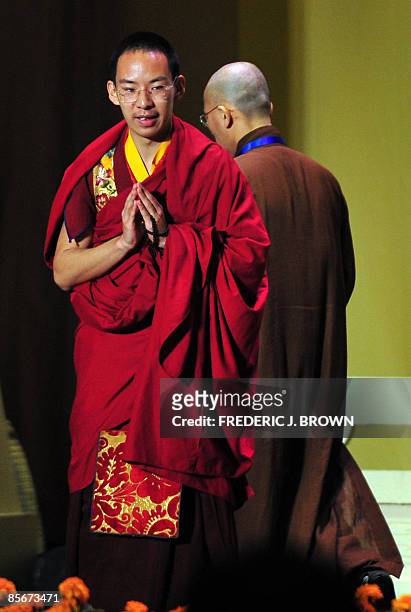 China's controversial choice as the second highest Tibetan spiritual figure, the 19-year-old Panchen Lama , gestures to the audience before...