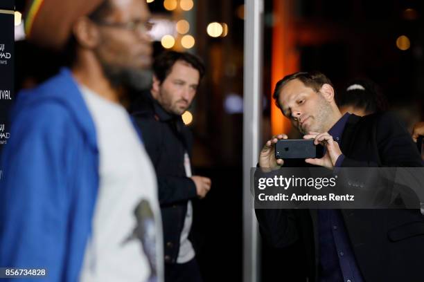 Matt Ruskin takes a picture of Colin Warner as they attends the 'Crown Heights' photocall during the 13th Zurich Film Festival on October 2, 2017 in...