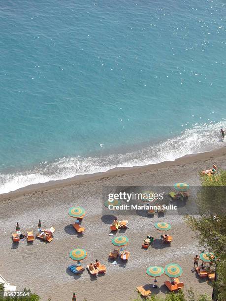 aerial view of beach umbrella's and ocean - positano italy stock pictures, royalty-free photos & images