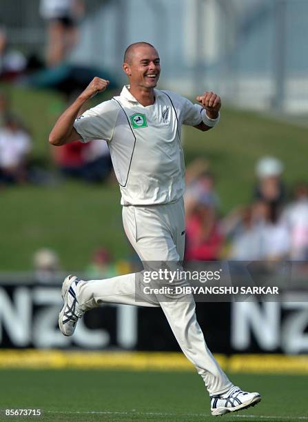 New Zealand cricket Chris Martin celebrates the wicket of unseen Indian batsman V.V.S.Laxman during the third day of the second Test match at the...