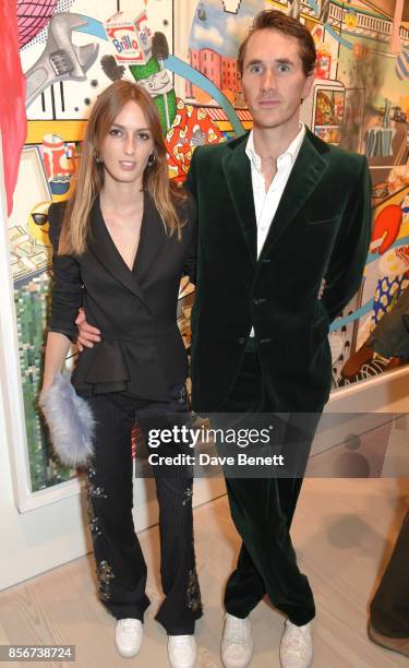 Lady Alice Manners and Otis Ferry attend a private view of "Philip Colbert: New Paintings" at The Saatchi Gallery on October 2, 2017 in London,...