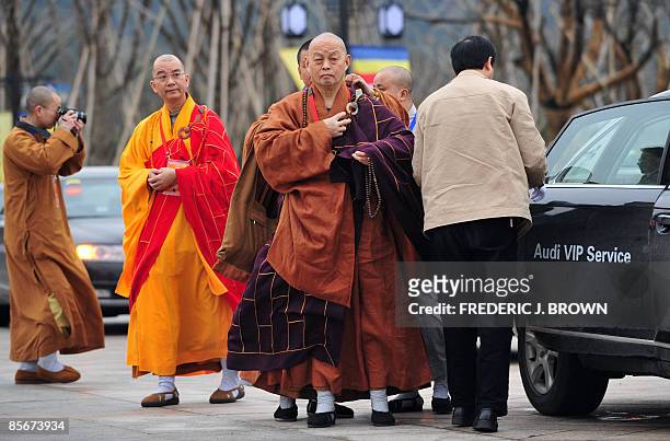 Buddhist monks arrive for the opening session of the World Buddhist Forum on March 28, 2009 in Wuxi, in eastern China's Jiangsu province, where...