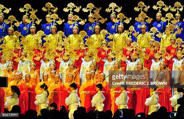 Buddhist monks participate with performers during the opening session of the World Buddhist Forum on March 28, 2009 in Wuxi, in eastern China's...