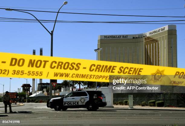 Crime scene tape surrounds the Mandalay Hotel after a gunman killed at least 58 people and wounded more than 500 others when he opened fire on a...