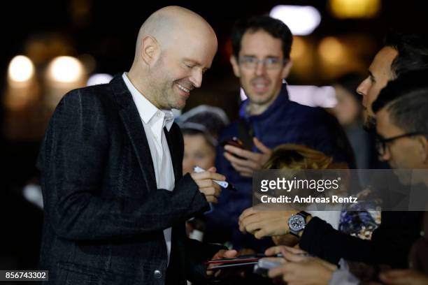 Marc Forster writes autographs as he attends the 'All I See Is You' premiere at the 13th Zurich Film Festival on October 2, 2017 in Zurich,...