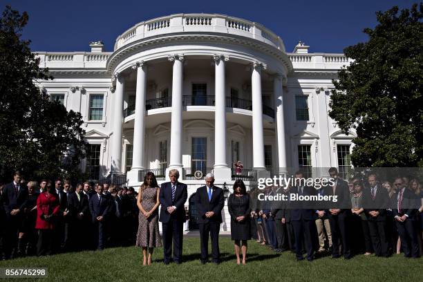 First Lady Melania Trump, from left, U.S. President Donald Trump, U.S. Vice President Mike Pence, and U.S. Second Lady Karen Pence participate with...