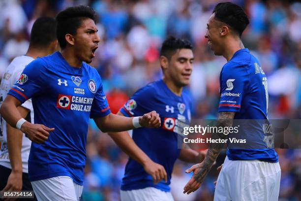 Martin Rodriguez of Cruz Azul celebrates with teammates after scoring the first goal of his team during the 12th round match between Pumas UNAM and...