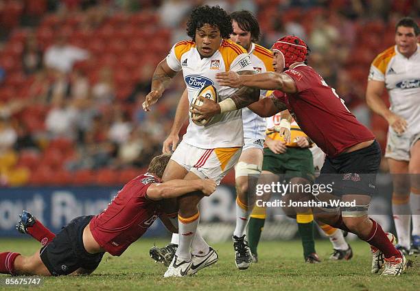 Sione Lauaki of the Chiefs in attack during the round seven Super 14 match between the Reds and the Chiefs at Suncorp Stadium on March 28, 2009 in...