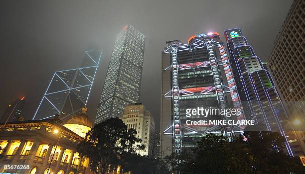 The Bank of China building, the Cheung Kong Centre, the HSBC Building and the Standard Chartered Bank building are lit up as they tower over the...