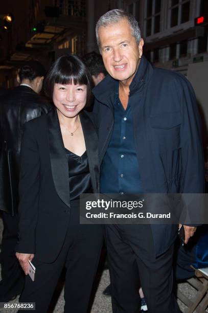 Mario Testino and Angelica Cheung attend the Alexander McQueen show as part of the Paris Fashion Week Womenswear Spring/Summer 2018 on October 2,...