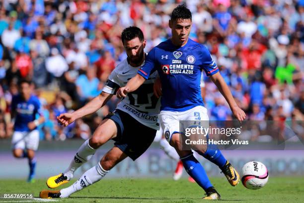 Luis Quintana of Pumas struggles for the ball with Felipe Mora of Cruz Azul during the 12th round match between Pumas UNAM and Cruz Azul as part of...