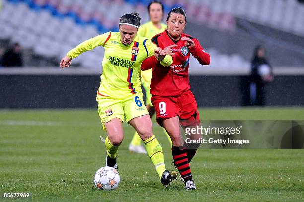 Jatoba of Lyon battles for the ball with Inka Grings of Germany during the UEFA Women's Cup semi final first leg match between Olympique Lyonnais and...