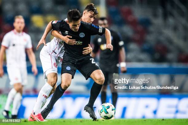 Fabian Schnellhardt of Duisburg and Florian Neuhaus of Duesseldorf fight for the ball during the Second Bundesliga match between Fortuna Duesseldorf...