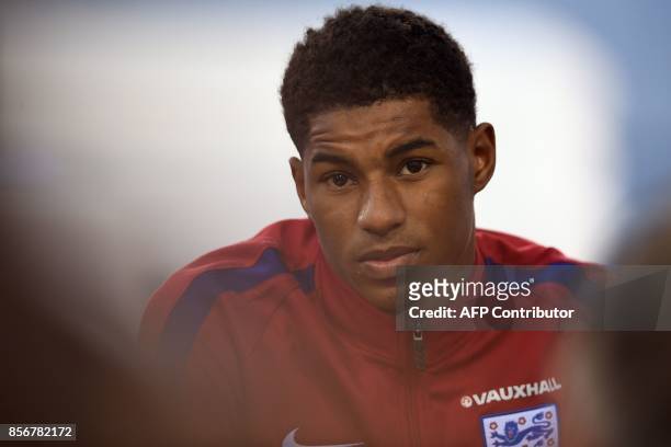 England's striker Marcus Rashford attends a press conference at St George's Park in Burton-on-Trent on October 2 as part of an England football team...