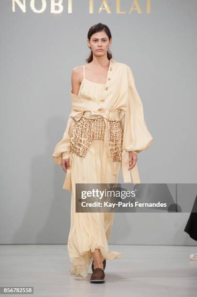 Model walks the runway during the Nobi Talai Paris show as part of the Paris Fashion Week Womenswear Spring/Summer 2018 on October 2, 2017 in Paris,...