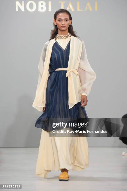 Model walks the runway during the Nobi Talai Paris show as part of the Paris Fashion Week Womenswear Spring/Summer 2018 on October 2, 2017 in Paris,...