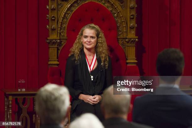 Julie Payette, governor general-designate of Canada, sits while being sworn in during an installation ceremony in the Senate Chamber of Parliament...