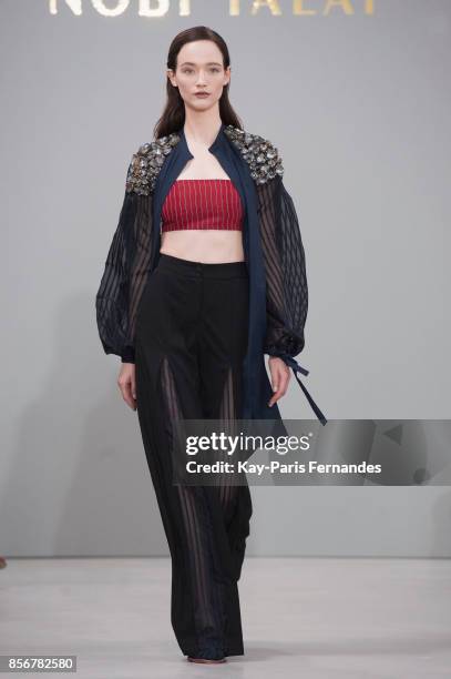 Model walks the runway during the Nobi Talai Paris show as part of the Paris Fashion Week Womenswear Spring/Summer 2018 on October 2, 2017 in Paris,...