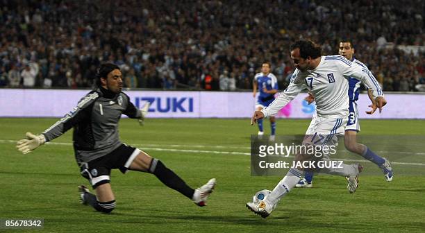Greece�s forward Theofanis Gekas vies for the ball with Israel�s goalkeeper Dudu Aouate at the Ramat Gan Stadium near Tel Aviv on March 28, 2009...