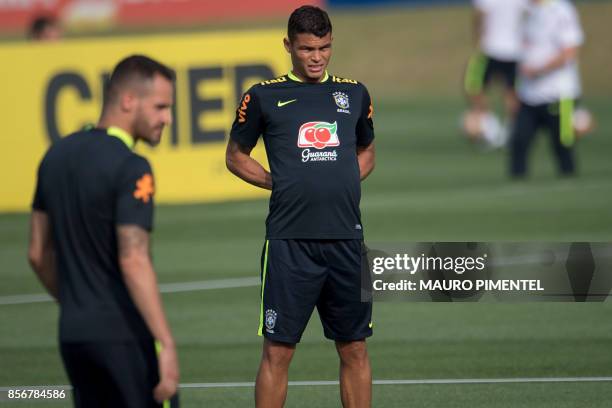 Brazil's Thiago Silva stretches during a training session at the Granja Comary sport complex in Teresopolis, about 90 km from Rio de Janeiro, Brazil,...
