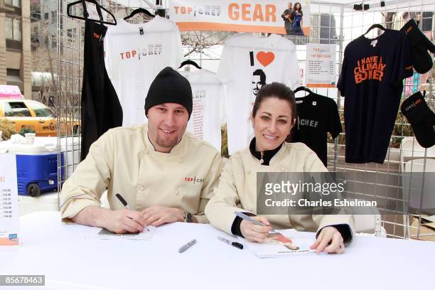 Chef's Hosea Rosenberg and Nikki Cascone sign autographs during the second day of "Top Chef: The Tour 2" at Flatiron Pedestrian Plaza on March 28,...