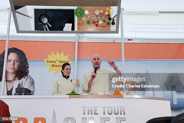 Chef's Nikki Cascone and Hosea Rosenberg cook during the second day of "Top Chef: The Tour 2" at Flatiron Pedestrian Plaza on March 28, 2009 in New...