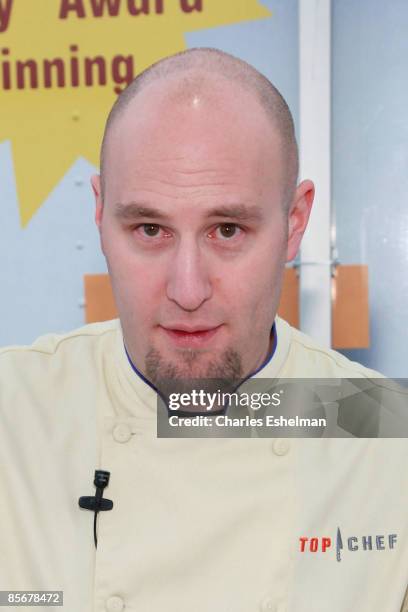 Chef Hosea Rosenberg cooks during the second day of "Top Chef: The Tour 2" at Flatiron Pedestrian Plaza on March 28, 2009 in New York City.