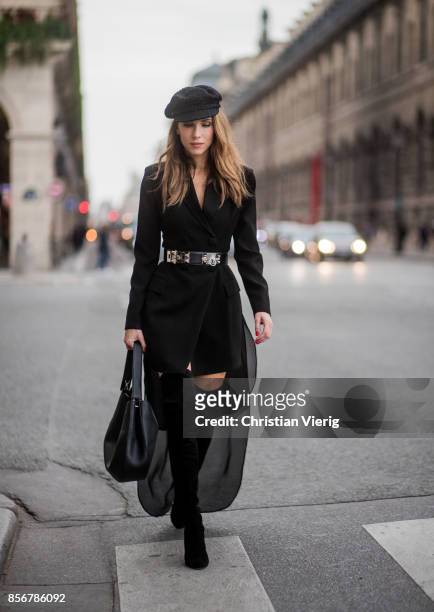 Alexandra Lapp wearing a Tuxedo Dress with detachable overlay in black from Pearl and Rubies, collier de chien waist belt by Hermes, black overknee...