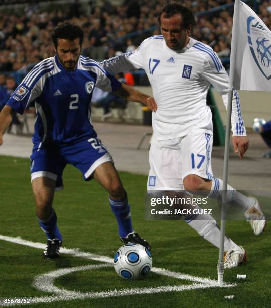 Greece�s forward Theofanis Gekas vies for the ball with Israel�s defender Klemi Saban during their European 2010 World Cup qualifying match at the...