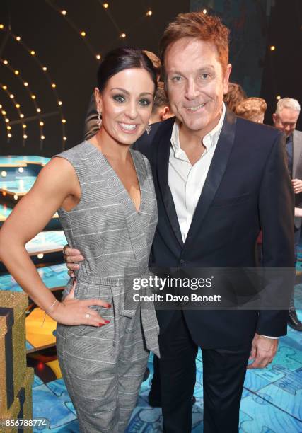 Amy Dowden and Brian Conley pose backstage following the cast change press night performance of "Annie" at The Piccadilly Theatre on October 2, 2017...