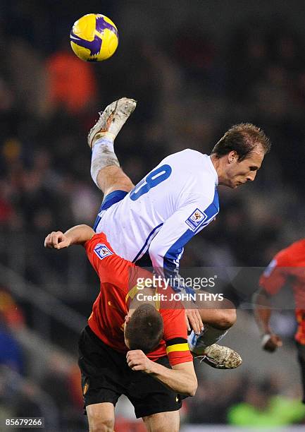 Bosnia Herzevogina's Zlatan Muslimovic vies with Belgian's Timmy Simoens during their World Cup 2010 qualifying football match in Genk on March 27,...