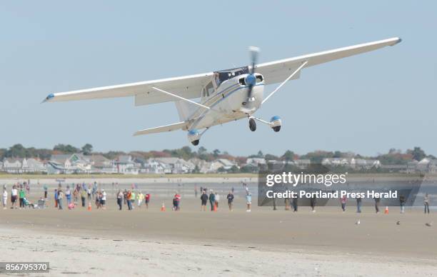 Pilot Jerry Polakewich of Biddeford pulls his Cessna 172 Hwk XP II back up while attempting to land on the beach in Old Orchard Beach on Sunday,...