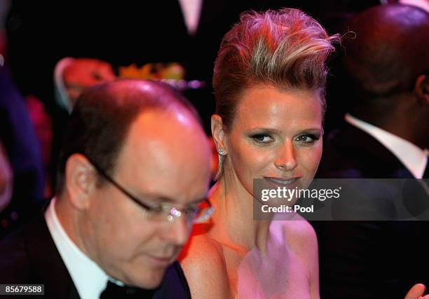 Prince Albert II of Monaco and Charlene Wittstock attend the 2009 Monte Carlo Rock' N Rose Ball held at The Sporting Monte Carlo on March 28, 2009 in...