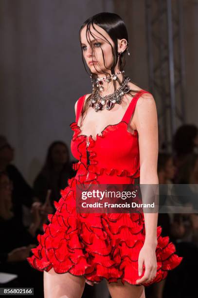 Model walks the runway during the Alexander McQueen Paris show as part of the Paris Fashion Week Womenswear Spring/Summer 2018 on October 2, 2017 in...