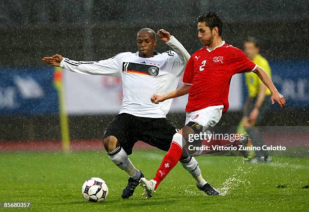 Germany forward Nserenko Savio and U20 Switzerland defender Serkan Sahin in action during the Under 20 international friendly match between...