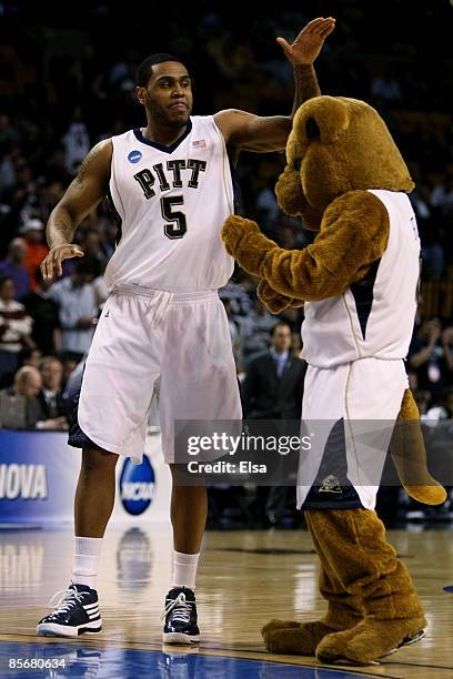 Tyrell Biggs of the Pittsburgh Panther pets the Panther mascot before Pitt takes on the Villanova Wildcats during the NCAA Men's Basketball...