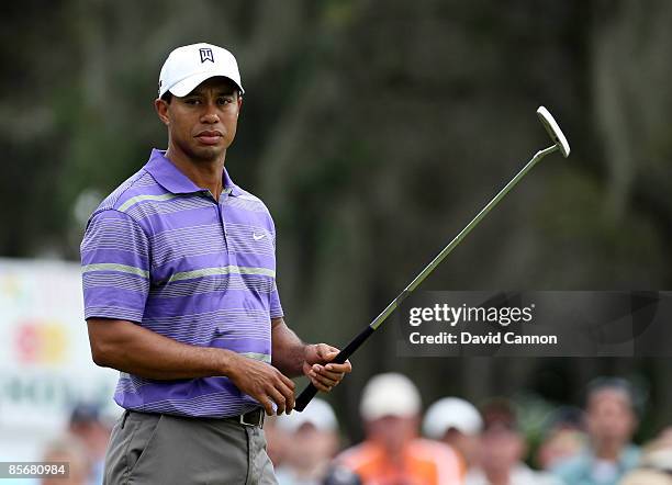 Tiger Woods of the USA putts at the 2nd hole during the third round of the Arnold Palmer Invitational Presented by Mastercard at the Bay Hill Club...