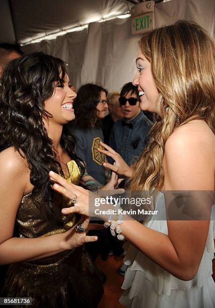 Actress Demi Lovato and singer/actress Miley Cyrus arrive at Nickelodeon's 2009 Kids' Choice Awards at UCLA's Pauley Pavilion on March 28, 2009 in...