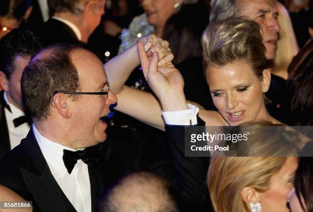 Prince Albert II of Monaco and Charlene Wittstock dance during the 2009 Monte Carlo Rock' N Rose Ball held at The Sporting Monte Carlo on March 28,...