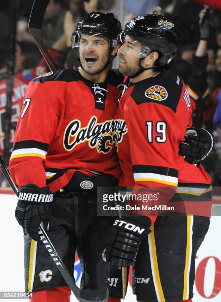 Lance Bouma and David Jones of the Calgary Flames play in a game against the Winnipeg Jets at Scotiabank Saddledome on February 2, 2015 in Calgary,...